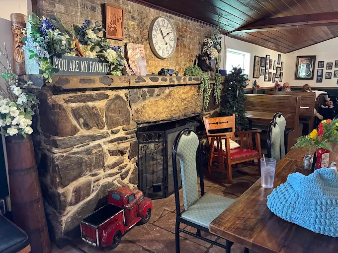 The Ambered Jack dining room with a stone fireplace